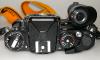 NIKON FE BLACK WITH MD-12, STRAP, IN GOOD CONDITION