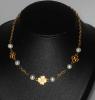 Chanel choker necklace in gold metal decorated with clovers and pearls, vintage 1983, very good condition