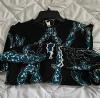 Louis Vuitton long-sleeved top in black silk with turquoise patterns and white stitching, size 36, new condition